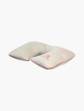   Grey neck pillow with orange trim